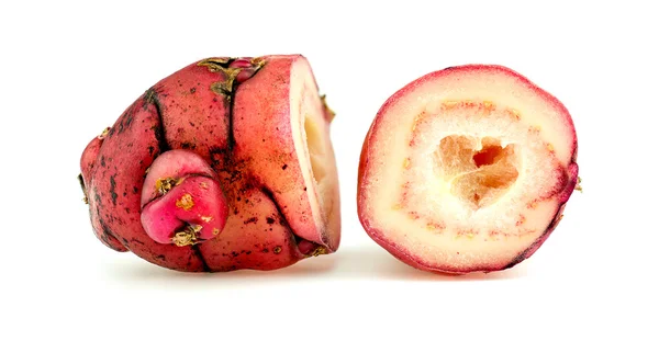 Macro closeup of halved pink oca new zealand yam — Stock Photo, Image