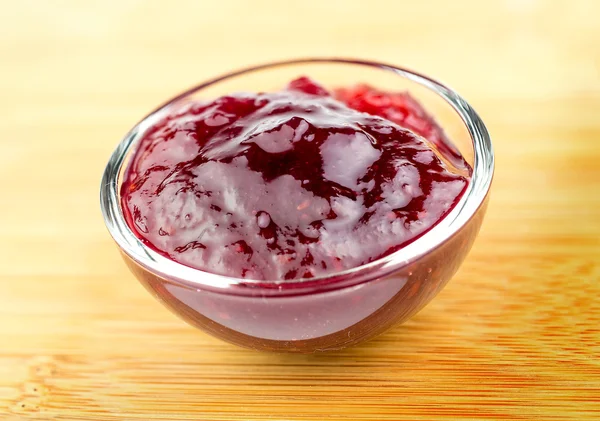 Tasty red raspberry jam in a bowl — Stock Photo, Image