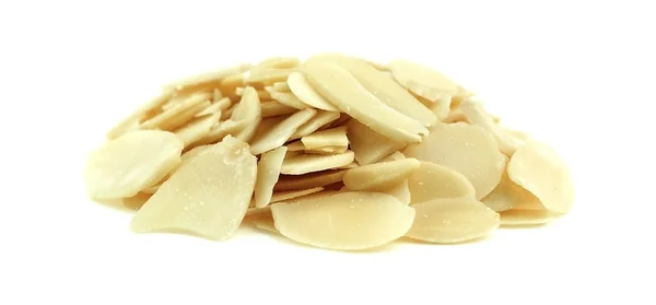 Isolated macro of a pile of thin almond slices — Stock Photo, Image