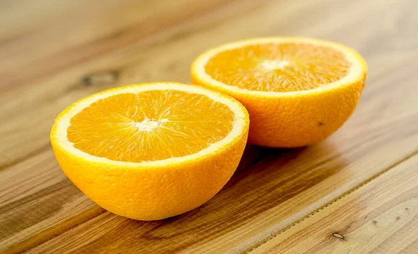 Tasty orange cut in half — Stock Photo, Image