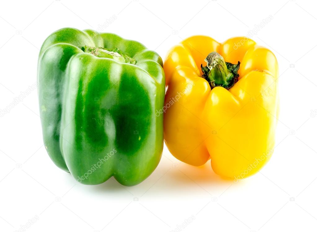 Isolated macro closeup of yellow and green bell peppers