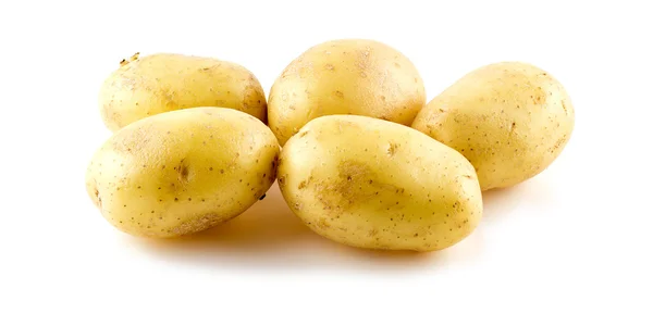 Gruppe leuchtend gelber, sauberer Kartoffeln auf weißen — Stockfoto
