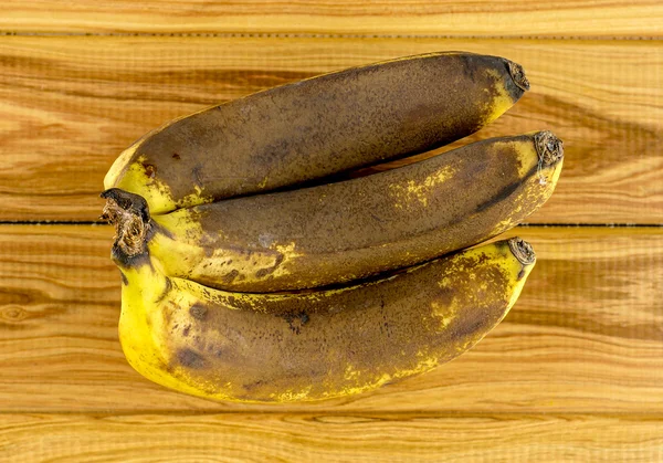 Brown and yellow expired bananas