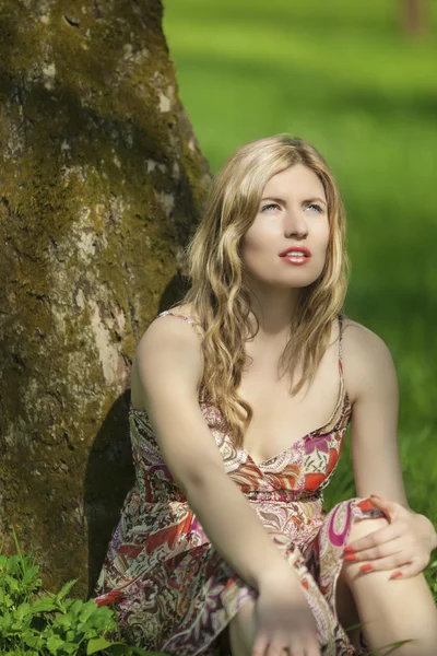 Fashion and Beauty Concept and Ideas. Portrait of Sensual Caucasian Blond Woman Posing Outdoors on Spring Time.