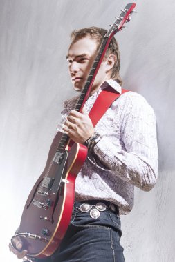 Music and Art Concepts. Portrait of Expressive Male Guitar Playe