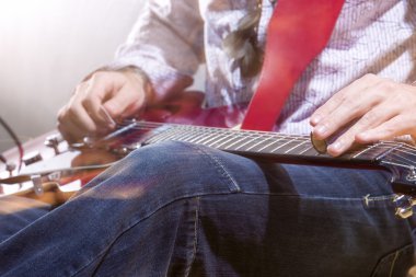 Professional Guitar Player with Electric Guitar Hands Closeup. S