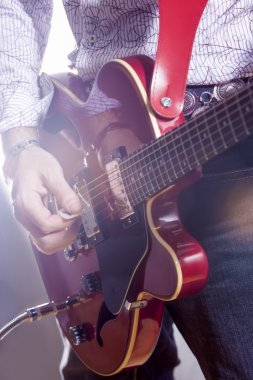 Music Concepts. Male Guitar Player Performing with Electric Guit