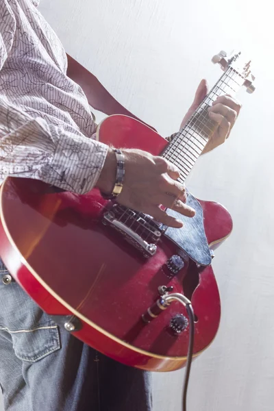 Male Guitar Player Performing with Electric Guitar Hands Closeup