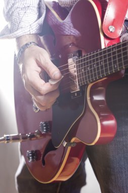 Music Concepts. Male Guitar Player Performing with Electric Guit