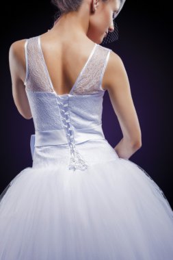 Profile Portrait of Caucasian Bride Posing in Gorgeous Wedding D