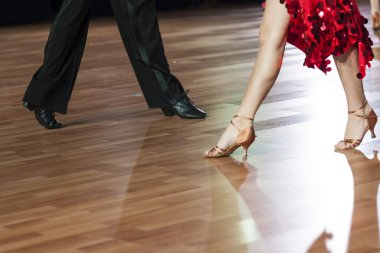 Closeup of Legs of Two Professional Dancers Performing Latin -American Program
