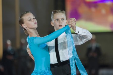 Minsk, Belarus-September 26, 2015: Zakharchenko Oleksiy and Vasina Anna  Perform Juvenile-1 Standard Program