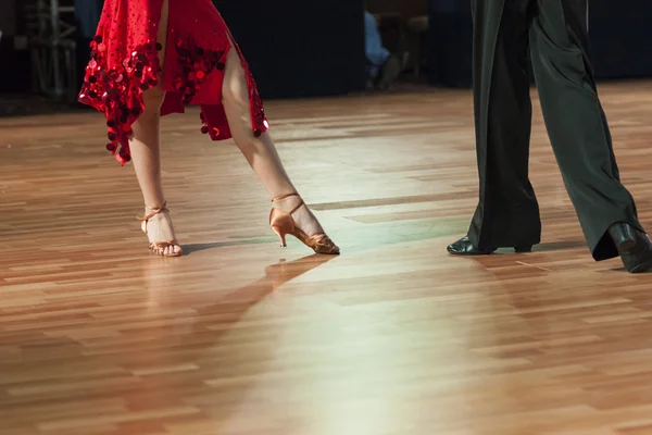Closeup of Legs of Two Professional Dancers Performing Latin -American Program