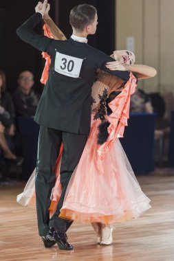 Minsk, Belarus-September 26, 2015: Ermolovich Konstantin and Snegir Anna Perform Juniors-2 Standard Program