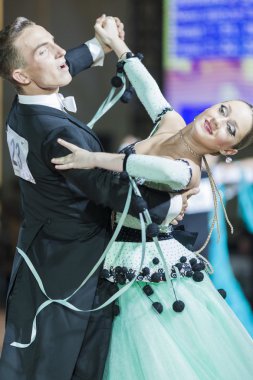 Minsk, Belarus-September 26, 2015: Rudyi Alexander and Medved Yanina Perform Juniors-2 Standard Program