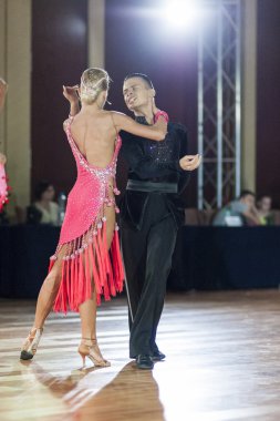 Minsk, Belarus-September 27, 2015: Egor Kosyakov and Anastasiya Belmach Perform Youth Latin- American Program on III International IDSA World Dance Championship Capital Cup Minsk-2015 on September 27, 2015, in Minsk, Belarus