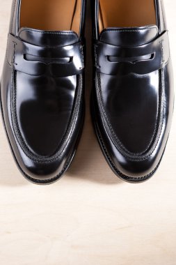 Pair Of Stylish Expensive Modern Leather Black Penny Loafers Shoes.closeup Shot