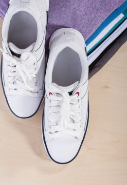 Fashion Ideas and Concepts. Pair of White Fasionable Sneakers Cl