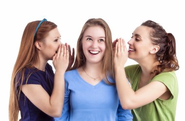 Portrait of Three Happy Caucasian Females Sharing Secrets and Rumoring To each Other To Ears