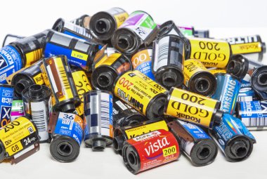 Minsk, Belarus-May 30, 2015: Bulk Variety of Old Photo Films Cassettes of Different World Leading Manufacturers Placed in Heap Together against White Background
