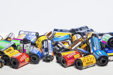 Minsk, Belarus-May 30, 2015: Bulk Variety of Old Photo Films Cassettes of Different World Leading Manufacturers Placed in Heap Together against White Background shot in Studio on May 30, 2015 in Minsk