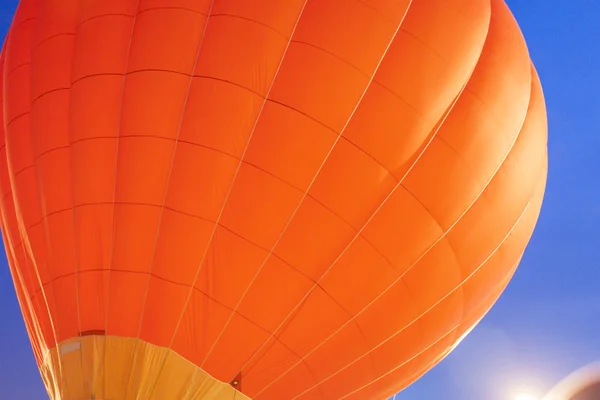 Impressive Red Air Balloon Levitating During its Night Show with Glowing Show Outdoors