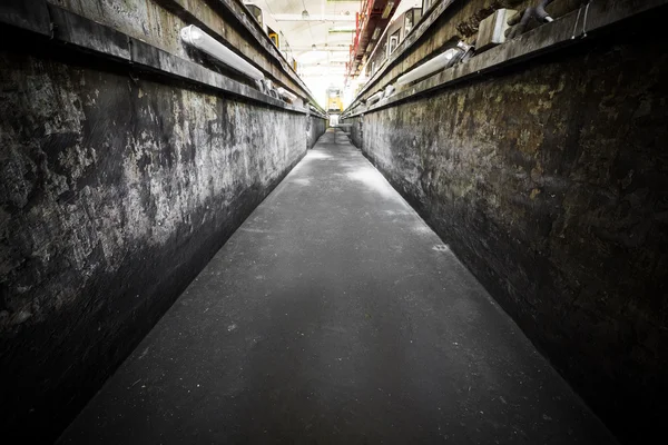 Ruins of an old tram garage inspection pit — 图库照片