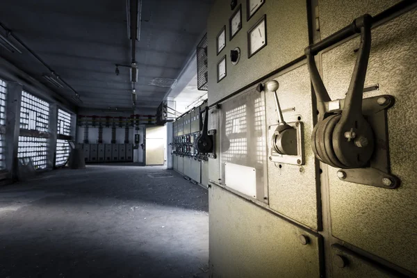 Electrical switchboards in an abandoned factory — Stock Photo, Image