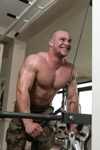 Young Man Exercising Triceps In The Gym — Stock Photo, Image