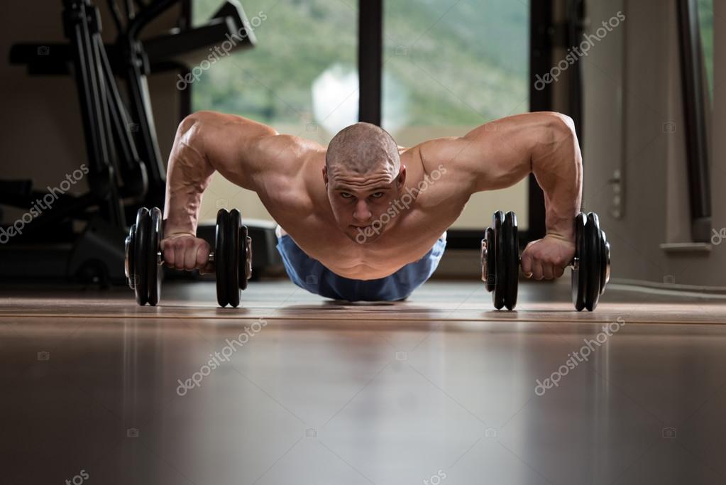Gym Man PushUp Strength Pushups With Dumbbell — Stock Photo © ibrak