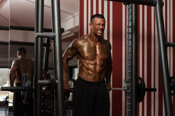 Bodybuilder Doing Heavy Weight Exercise For Trapezius — Stock Photo, Image