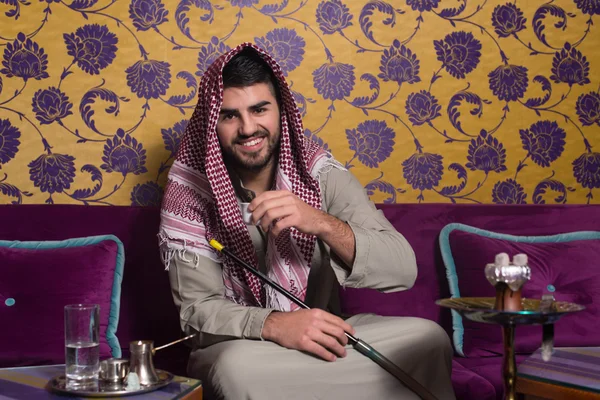 Arab Man Smoking Shisha And Drinking Coffee — Stock Photo, Image