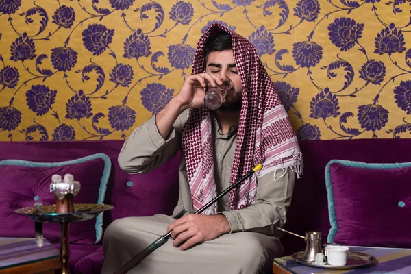 Arab Man Smoking Shisha And Drinking Coffee — Stock Photo, Image