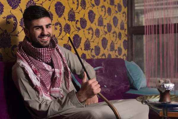 Islamic Man Smoking Shisha In The Arabic Cafe — Stock Photo, Image