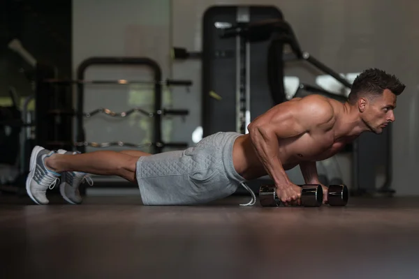 Young Man Doing Push Ups With Dumbbells On Floor — Stock Photo, Image