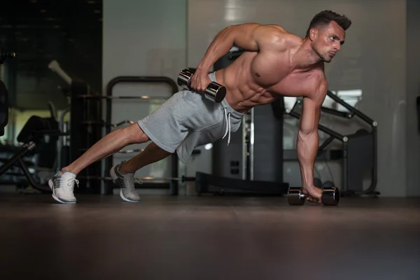 Bodybuilder Doing Push Ups With Dumbbells On Floor — Stock Photo, Image