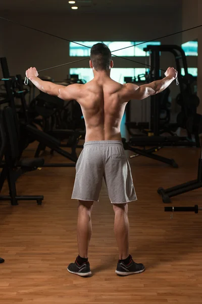 Bodybuilder Exercising Back On Cable Machine — Stock Photo, Image