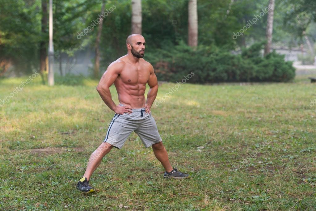 Stretching Exercise Outdoors Workout In Park — Stock Photo © ibrak