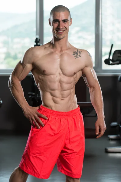 Healthy Young Man Flexing Muscles — Stock Photo, Image