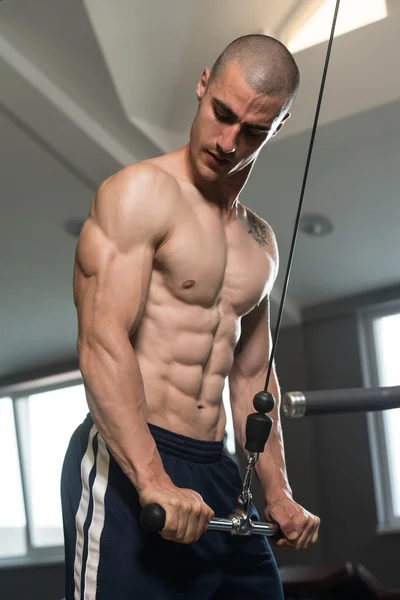 Bodybuilder Doing Heavy Weight Exercise For Triceps With Cable — Stock Photo, Image