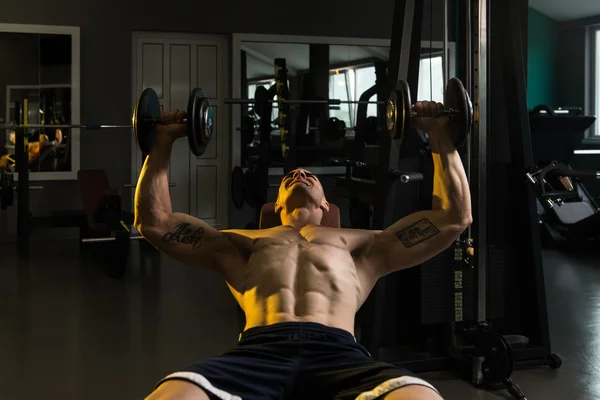 Bodybuilder Exercising Chest With Dumbbells — Stock Photo, Image