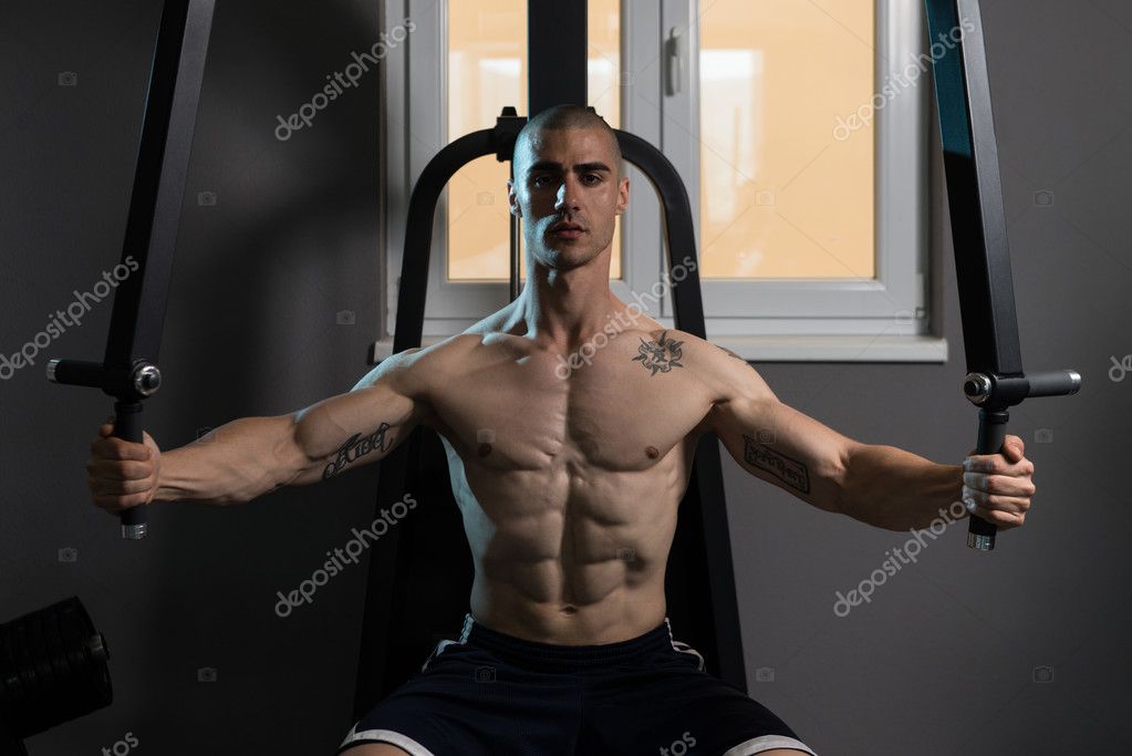 Butterfly Chest Exercise On Machine Stock Photo by ©ibrak 110053554