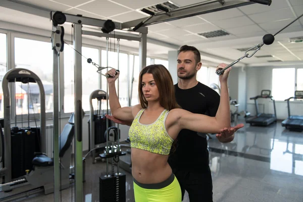 Personal Trainer Helping Client In Gym — Stock Photo, Image