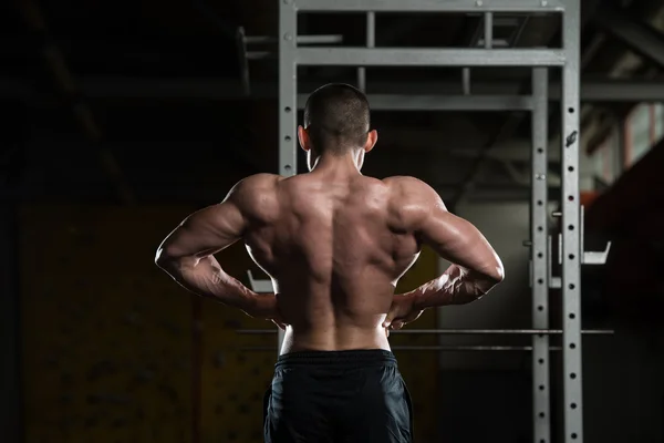 Bodybuilder Flexing Rear Lat Spread Pose — Stock Photo, Image