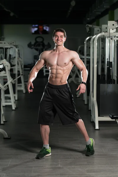 Healthy Young Man Flexing Muscles — Stock Photo, Image