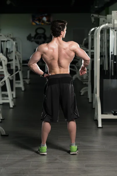 Young Bodybuilder Flexing Back Pose — Stock Photo, Image