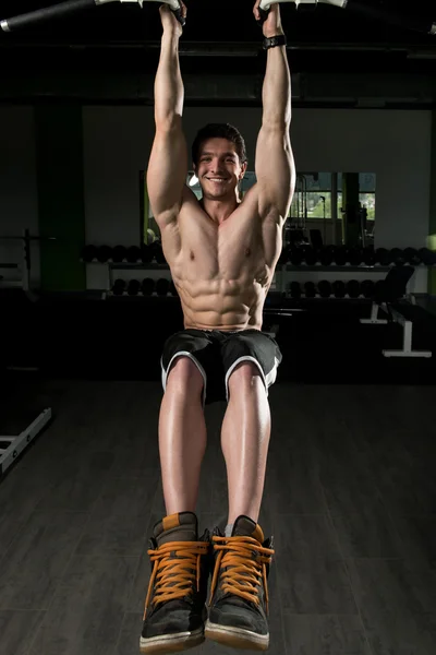 Young Man Performing Hanging Leg Raises Exercise — Stock Photo, Image