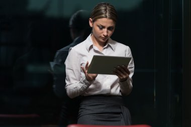 Young Woman Working On Touchpad In Office