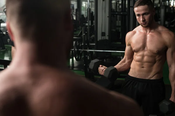 Young Man Exercise Biceps With Dumbbells — Stock Photo, Image