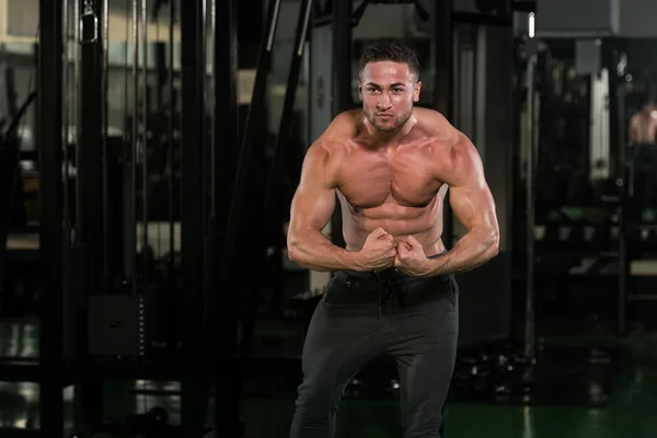 Handsome Body Builder Making Most Muscular Pose — Stock Photo, Image